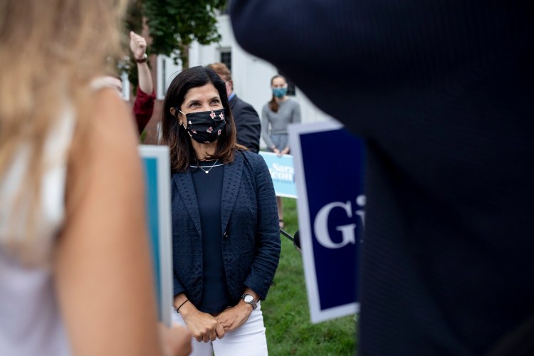 Maine House Speaker Sara Gideon greets some of her supporters near the Woodfords Club in Portland on primary day, July 14.
