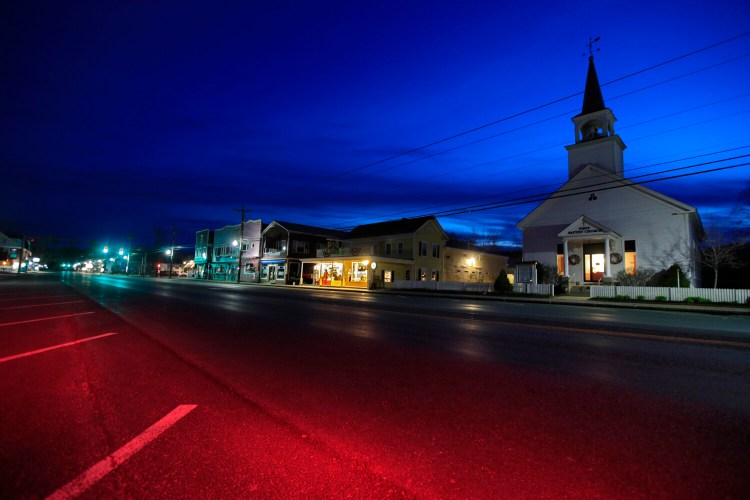 The First Baptist Church and small shops remain closed during the coronavirus pandemic, Sunday, April 26, 2020, in North Conway, N.H. (AP Photo/Robert F. Bukaty)