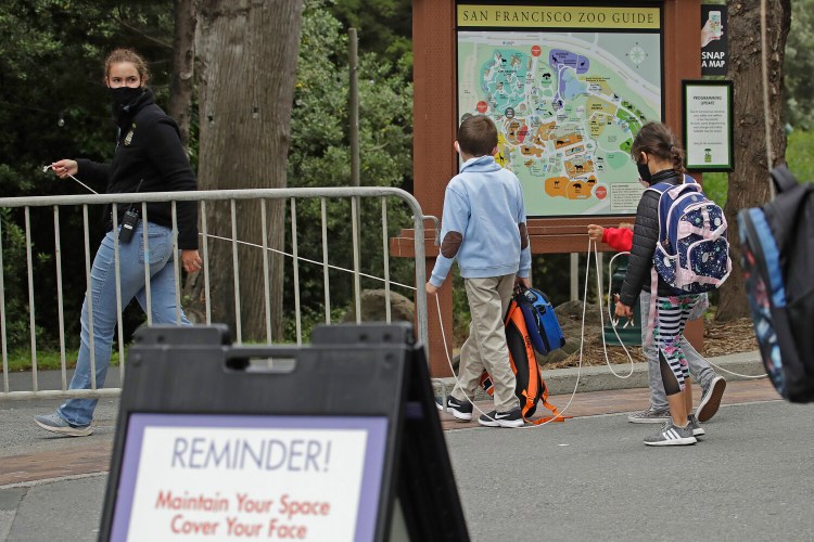 A class keeps social distance at the San Francisco Zoo on Monday in San Francisco. 