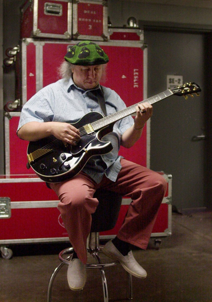 British rock and blues guitarist Peter Green, a founding member of Fleetwood Mac, warms up backstage before performing with his own band, Peter Green's Splinter Group, in 2001