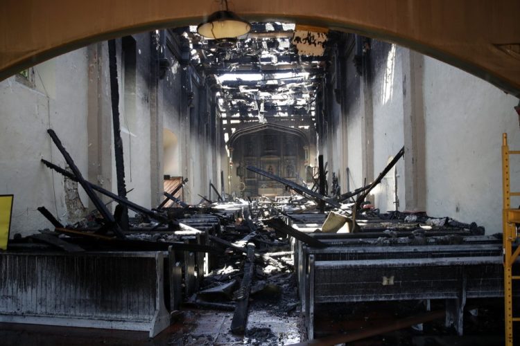 The interior of the San Gabriel Mission is damaged following a morning fire Saturday in San Gabriel, Calif. 