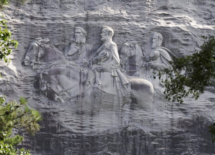 A carving depicting Confederate Civil War figures Stonewall Jackson, Robert E. Lee and Jefferson Davis in Stone Mountain, Ga. 