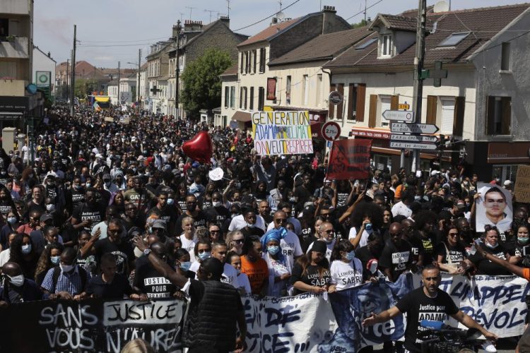 Demonstrators take part in a march to mark the fourth anniversary of the death of Adama Traore, a Black man in police custody, whose case has mobilized broad anger against police brutality and racial injustice, in Beaumont-Sur-Oise, a  suburb of Paris, on Saturday.

