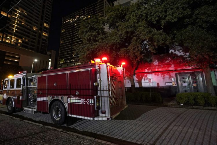 A firetruck is positioned outside the Chinese Consulate Wednesday in Houston. Authorities responded to reports of a fire at the consulate. Witnesses said that people were burning paper in what appeared to be trash cans, according to police. China says the U.S. has ordered it to close its consulate in Houston in what it called a provocation that violates international law.