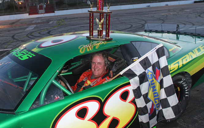 Jeff Taylor of Norridgewock smiles in victory lane at Oxford Plains Speedway last Sunday night. The nine-time track champion has won in both of his starts in 2020.