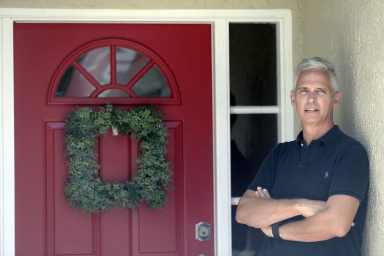 Bob Garick stands by the entrance to his home Wednesday in Oviedo, Fla. Garick was looking forward to being a field supervisor during the door-knocking phase of the 2020 Census, but as the number of new coronavirus cases in Florida shot up last month, he changed his mind and decided not to take the job.

