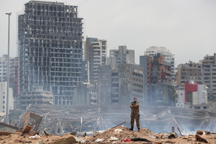 A soldier stands at the devastated site of the explosion in the port of Beirut, Lebanon, on Thursday.

