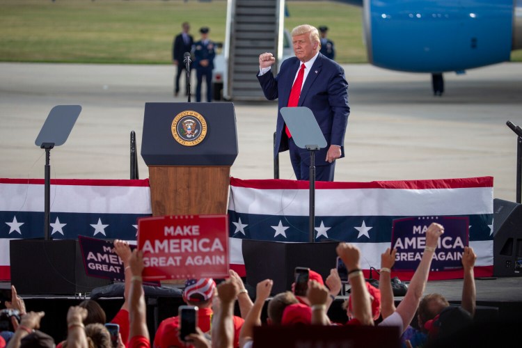 President Donald Trump speaks at an event at the Wittman Regional Airport on Monday in Oshkosh, Wis. "This is the most important election we've ever had," Trump told the crowd as they enthusiastically chanted, "Four more years!"