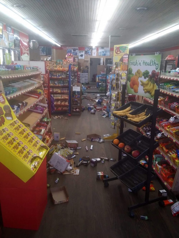 Various items litter the floor of the 4 Brothers Store in Sparta, N.C. after an earthquake shook much of North Carolina early Sunday.