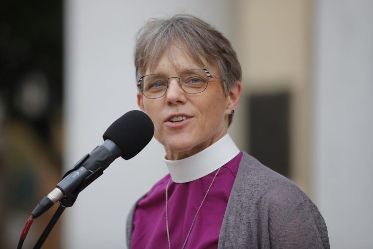 Bishop Mariann Edgar Budde of the Esiscopal Diocese of Washington speaks during a service outside St. John's Episcopal Church in Washington.