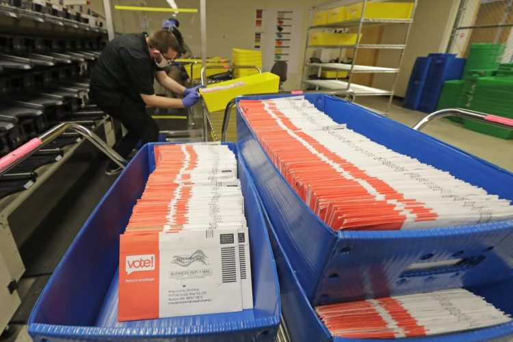 Vote-by-mail ballots are shown in sorting trays Wednesday at the King County Elections headquarters in Renton, Wash., south of Seattle. Never in U.S. history will so many people exercise the right on which their democracy hinges by marking a ballot at home. 

