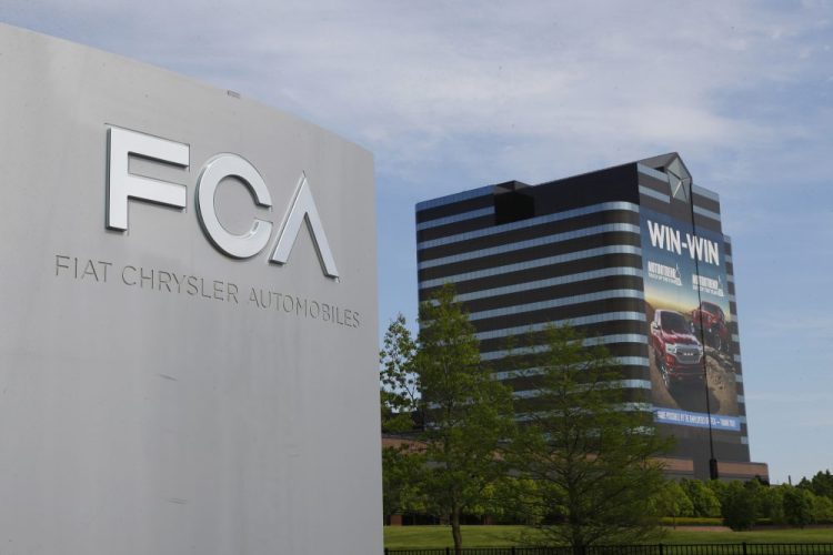 FILE - This May 27, 2019, file photo shows the Fiat Chrysler Automobiles world headquarters in Auburn Hills, Mich.Fiat Chrysler Automobiles is denying allegations by General Motors that FCA used foreign bank accounts to bribe union officials so they would stick GM with higher labor costs. In court papers filed Monday, Aug. 10, 2020, the Italian-American automaker said GM was using court records to make “defamatory and baseless" claims.  (AP Photo/Paul Sancya, File)