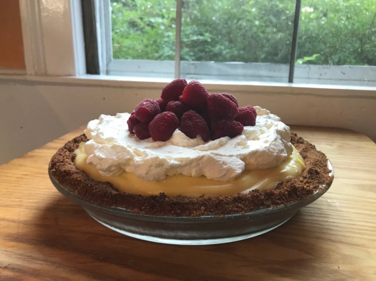 Banana Cream Pie topped with raspberries. 