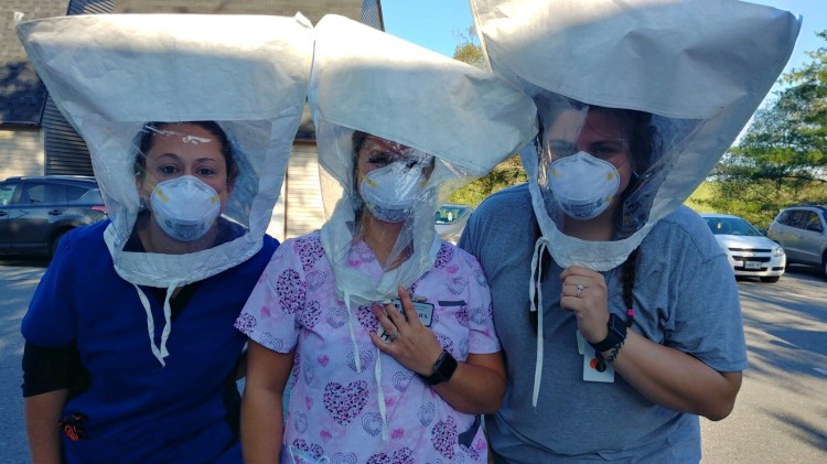 From left, Kaila O’Donnell, RN; Hannah Smith, C.N.A. and Sydney Perry, C.N.A., all work on the Memory Care for A Company of Maine Veterans’ Homes - Augusta, recently were fit tested by members of the Maine National Guard task force med team.

