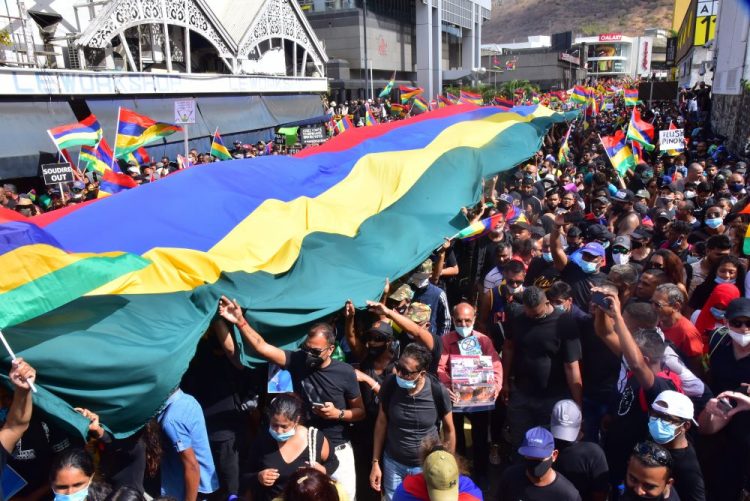 Tens of thousands of people protest in Port Louis, Mauritius, on Saturday over the government's slow response to an oil spill  and the discovery of dozens of dead dolphins.