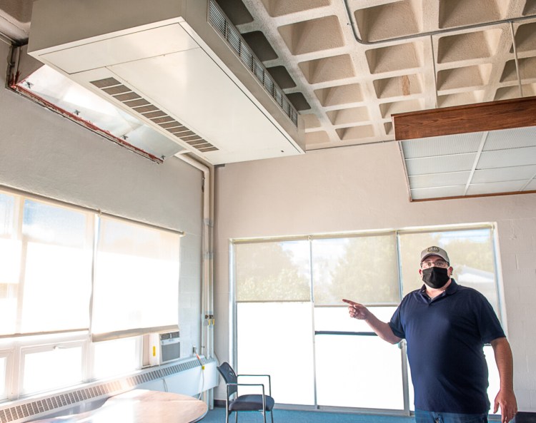 In August 2020, Josh Breau, Lewiston Public Schools facilities director, points out the Unit Ventilator on the ceiling of one of the classrooms in the Longley Building. With the exception of four small rooms, all classroom spaces have similar ventilators.