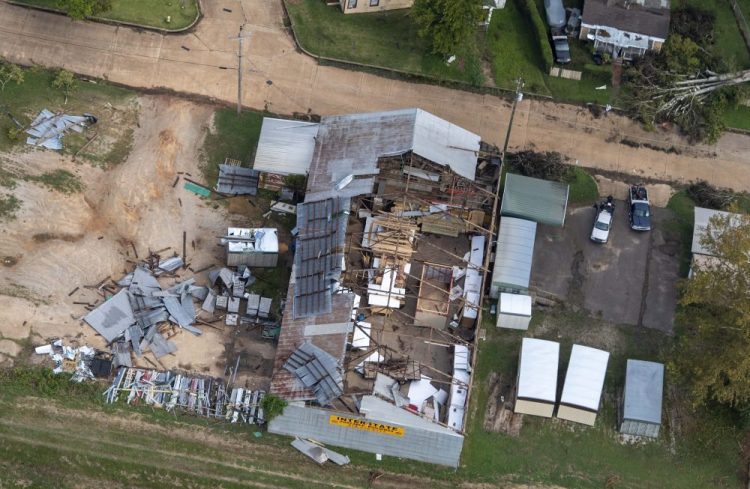 Damage to a roof from Hurricane Laura is seen Friday in Pineville, La., during Gov. John Bel Edwards' aerial tour of stricken areas in the northern part of the state. 