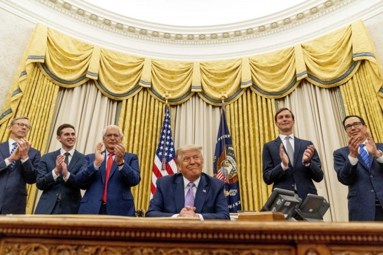 President Trump, accompanied by, from left, U.S. special envoy for Iran Brian Hook; Avraham Berkowitz, assistant to the president and special representative for international negotiations; U.S. Ambassador to Israel David Friedman, White House senior adviser Jared Kushner; and Treasury Secretary Steven Mnuchin at the White House, Wednesday in Washington. Trump said on Thursday that the United Arab Emirates and Israel have agreed to establish full diplomatic ties as part of a deal to halt the annexation of occupied land sought by the Palestinians for their future state.