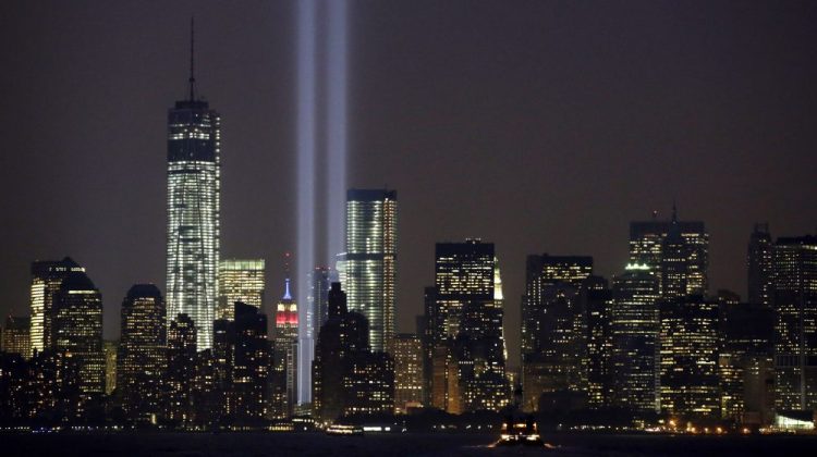 The twin beams of the annual Tribute in Light commemorating the Sept. 11, 2001, terrorist attacks shine amid the city's skyline, Sept. 11, 2013, in New York. 