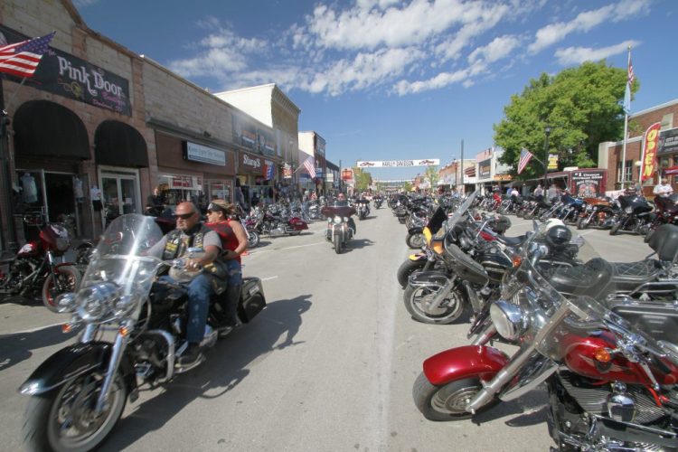 Thousands of bikers rode through the streets for the opening day of the 80th annual Sturgis Motorcycle rally Friday in Sturgis, S.D. 