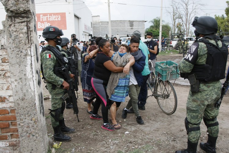A woman cries outside the rehabilitation center attacked by armed assailants in Irapuato, Guanajuato, Mexico on July 1. Twenty-four people were killed and seven were injured, local media reported. The state has become one of the most dangerous regions in the country. 
