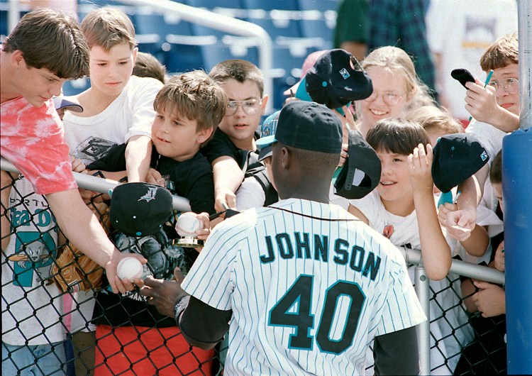 Young fans swarm catcher Charles Johnson hoping for his autograph in July of 1994 during the Sea Dog's first season at Hadlock Field.

MeBi