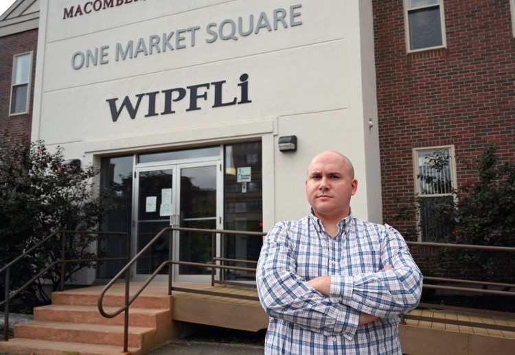 Senior Tax Manager Mike Santo outside Wipfli in Augusta on Wednesday. Accountants say the rules for filing state income taxes are unclear as they apply to residents working in another state because of the coronavirus pandemic.