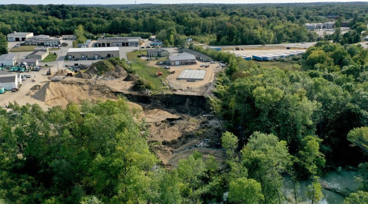 The landslide that blocked the Presumpscot River occurred behind 161 Warren Ave. in Westbrook on Wednesday morning.