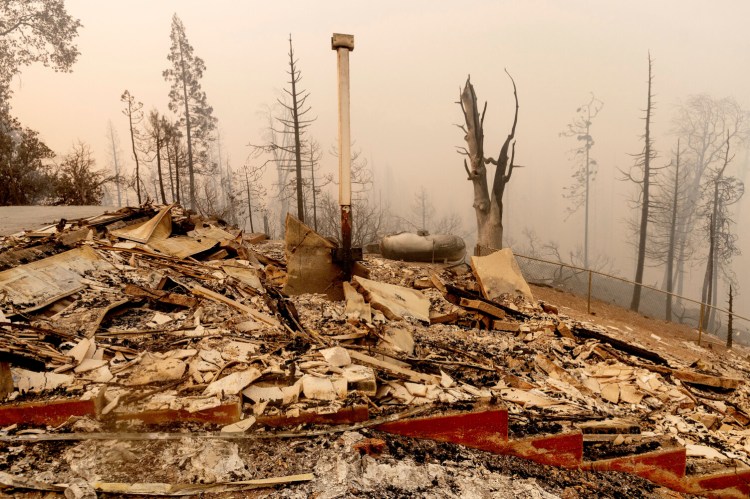Charred remains is all that is left of a home destroyed by the Creek Fire on Tuesday, Sept. 8, in Fresno County, Calif. 