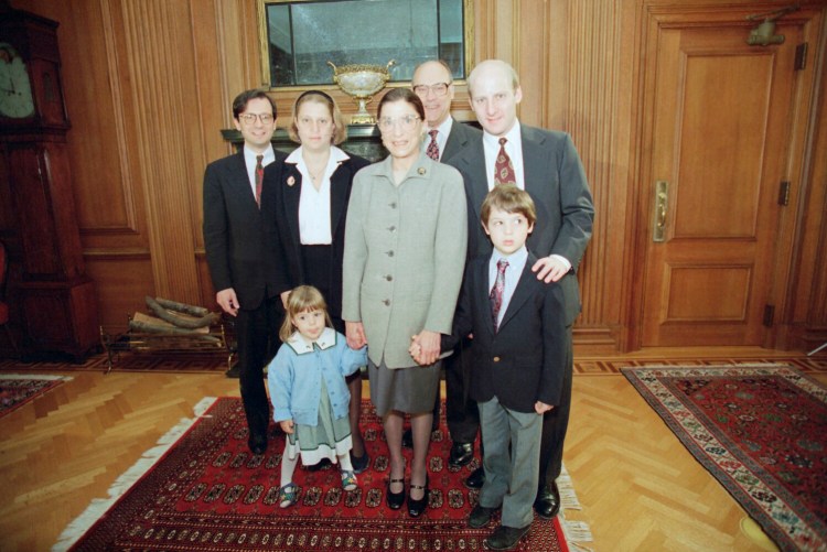 FILE - In this Oct. 1, 1993, file photo, Supreme Court Justice Ruth Bader Ginsburg, center, poses with her family at the Court in Washington. From left are, son-in-law George Spera, daughter Jane Ginsburg, husband Martin, son James Ginsburg. The judge's grandchildren Clara Spera and Paul Spera are in front. (AP Photo/Doug Mills, File)