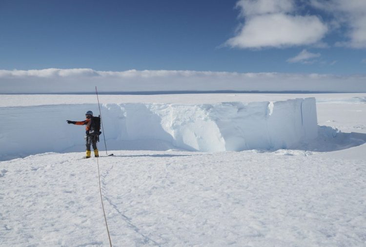 Field guide Andy Hood traverses the Brunt ice shelf in Antarctica last January. Now, as nearly 1,000 scientists and others who wintered over on the ice are seeing the sun for the first time in months, a global effort wants to make sure incoming colleagues don't bring the virus with them. (Robert Taylor/British Antarctic Survey via AP)