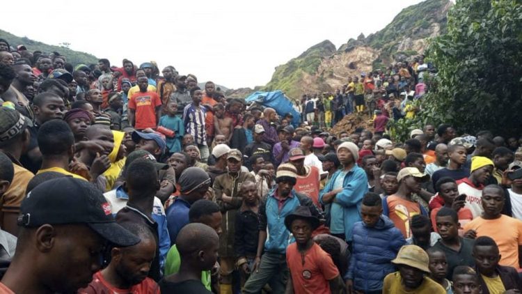 People gather at the scene of a gold mine collapse near the town of Kamituga, South Kivu province, in eastern Congo on Friday.