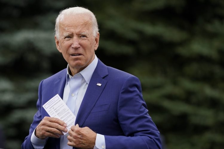 Democratic presidential candidate and former Vice President Joe Biden places a note card in his jacket pocket as he speaks at a campaign event on manufacturing and buying American-made products at UAW Region 1 headquarters in Warren, Mich., onWednesday, Sept. 9. 