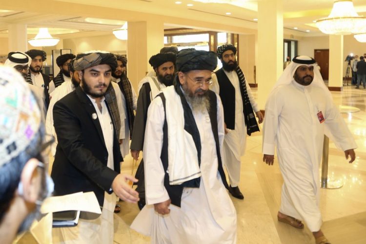 Taliban delegation arrive to attend the opening session of the peace talks Saturday between the Afghan government and the Taliban in Doha, Qatar.