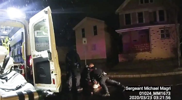In this image taken from police body camera video,  Rochester police officers hold down Daniel Prude on March 23 in Rochester, N.Y. Prude died of asphyxiation. 
