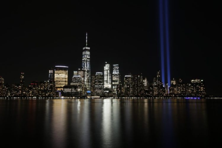 The Tribute in Light illuminates in the sky above the Lower Manhattan area of New York on Sept. 11, 2017, as seen from across the Hudson River in Jersey City, N.J.