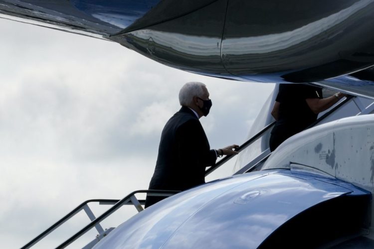 Vice President Mike Pence boards Air Force Two after attending a ceremony marking the 19th anniversary of the 9/11 terrorist attacks at the National September 11 Memorial & Museum, on Friday in New York. 