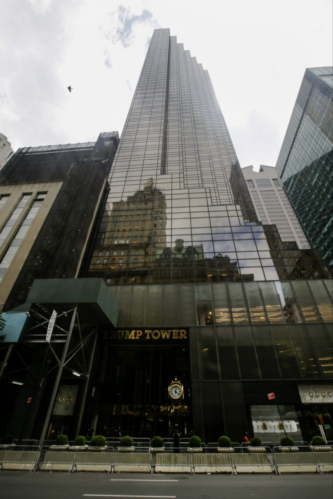 Pedestrians walk past the Trump Tower building in New York in July 2020.