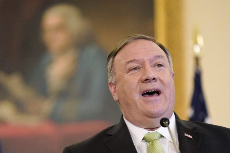 Secretary of State Mike Pompeo speaks during a news conference to announce the Trump administration's restoration of sanctions on Iran on Monday at the U.S. State Department in Washington. He said  the U.S. was not acting alone but on behalf of the rest of the world which is refusing to confront the Iranian threat.