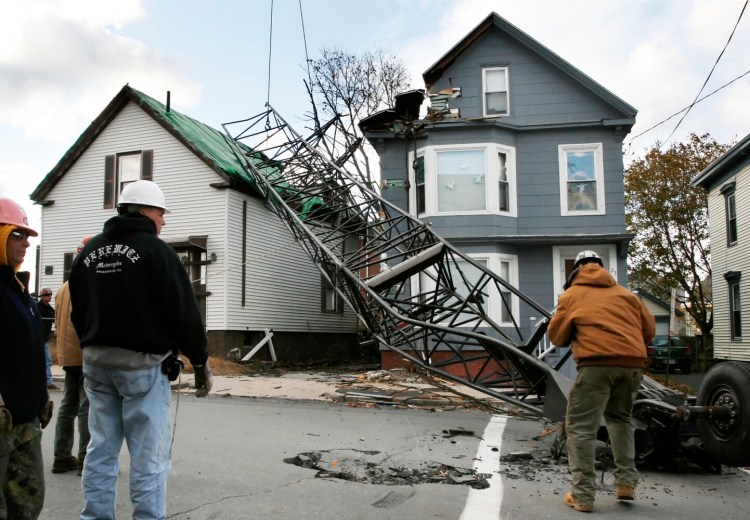 A crane from a construction area at Maine Medical Center toppled over, damaging several homes on Ellsworth Street in Portland on Oct. 29, 2006.