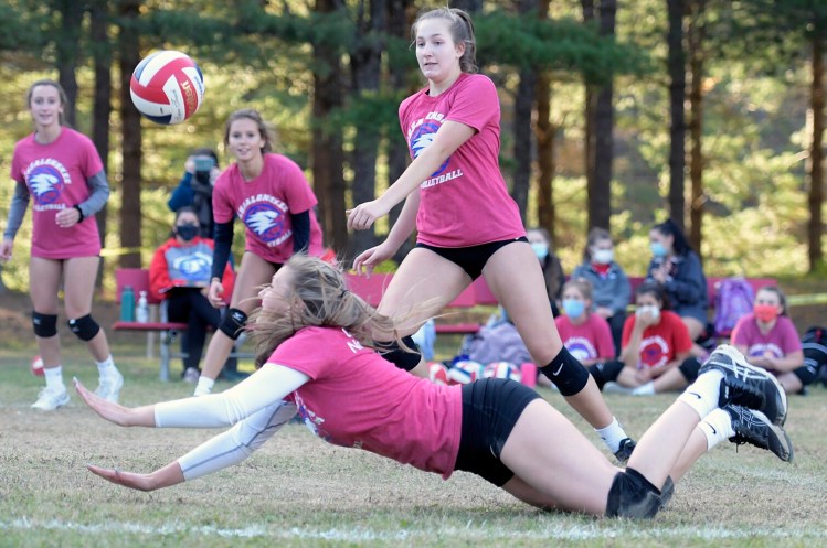 A Messalonskee volleyball player reaches for the ball during a an Oct. 5 game in Augusta. This fall was supposed to be the varsity debut of the Messalonskee volleyball team.