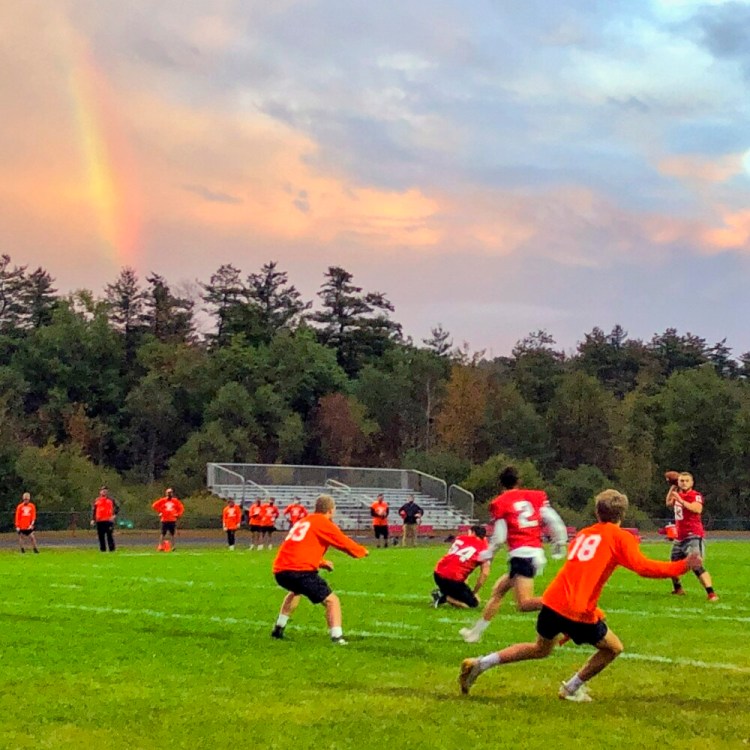 A rainbow glows over a 7-on-7  game between Cony and Gardiner on Oct. 2 at Alumni Field in Augusta.
