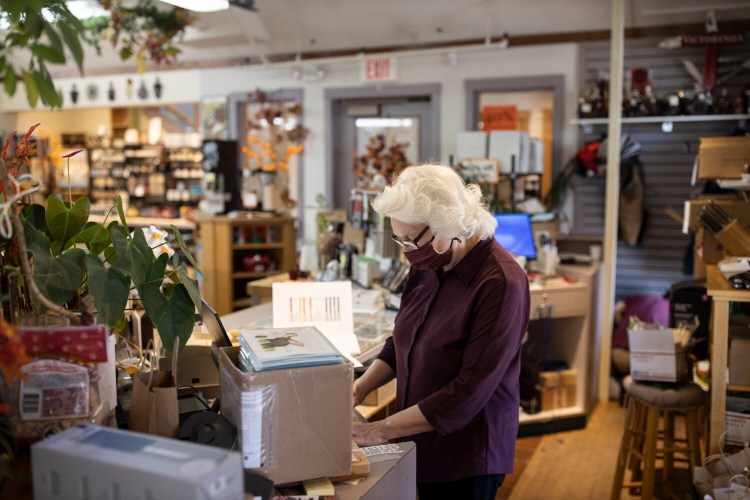 FREEPORT, ME - OCTOBER 8: Rhoda Dillman works behind the counter at Casco Bay Cutlery & Kitchenware on Thursday, October 8, 2020. The Dillmans, who have owned the store for decades, said they have remained busy during the course of the pandemic. (Staff photo by Brianna Soukup/Staff Photographer)