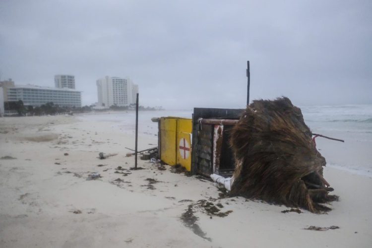 A lifeguard tower lays on its side after it was toppled over by Hurricane Delta in Cancun, Mexico, early Wednesday. Hurricane Delta made landfall Wednesday just south of the Mexican resort of Cancun as a Category 2 storm, downing trees and knocking out power to some resorts along the northeastern coast of the Yucatan Peninsula. 