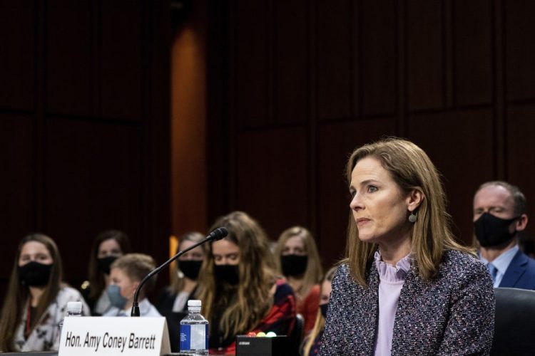 Supreme Court nominee Amy Coney Barrett listens during a confirmation hearing before the Senate Judiciary Committee, on Wednesday on Capitol Hill in Washington. 
