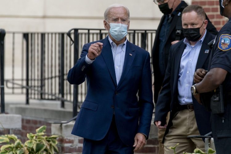 Democratic presidential candidate former Vice President Joe Biden speaks to the media as he leaves St. Joseph Catholic Church on Saturday in Wilmington, Del. 

