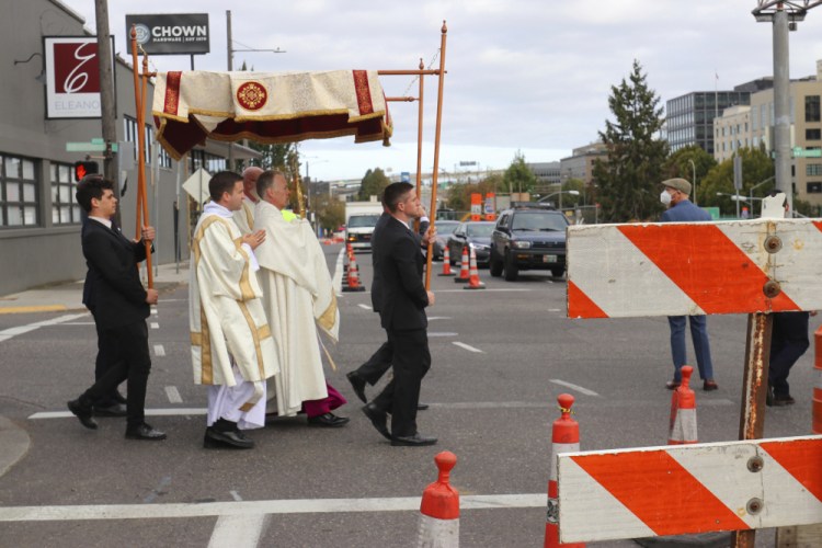 Archbishop Alexander Sample carries the Eucharist into downtown Portland, Ore., for an exorcism and rosary to bring peace and justice to the city on Oct. 17.  