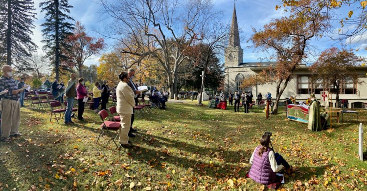 Members of Christ Episcopal Church's congregation gather in the church yard for a special ceremony held Sunday to celebrate the church's bicentennial.