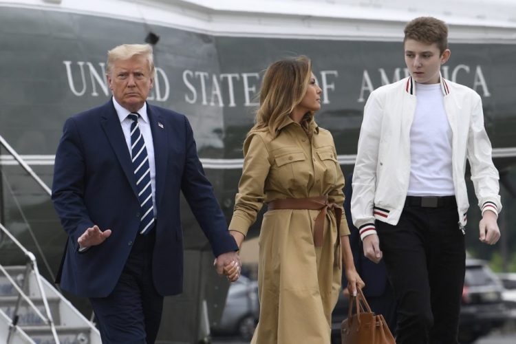 President Trump, first lady Melania Trump and their son, Barron Trump, shown in August, all tested positive for COVID-19. Melania Trump said Wednesday he has now tested negative. 