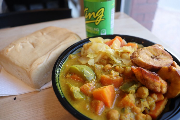 Yardie Ting's Coconut Curry plus two vegan sides, steamed vegetables and fried plantains.